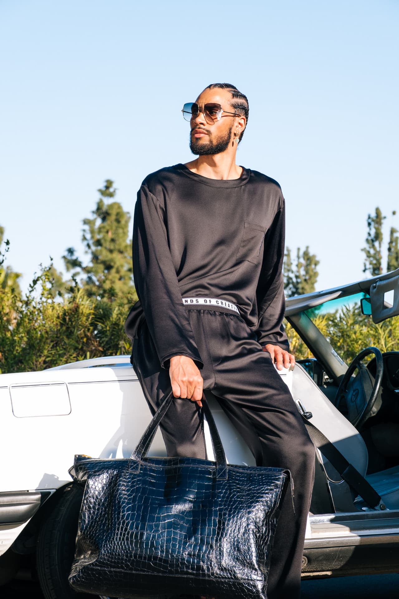 Black satin loungewear set with croc-effect tote
