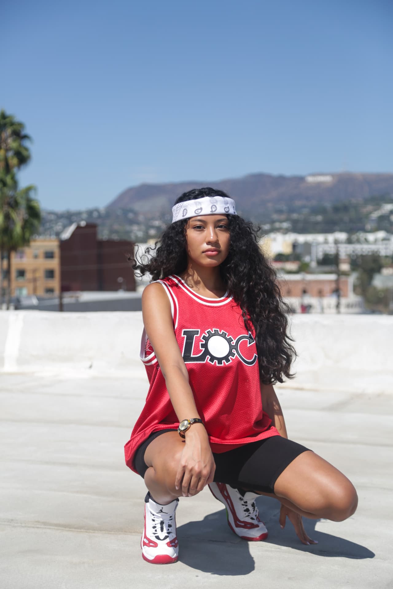 Red mesh jersey styled on a rooftop above the hills
