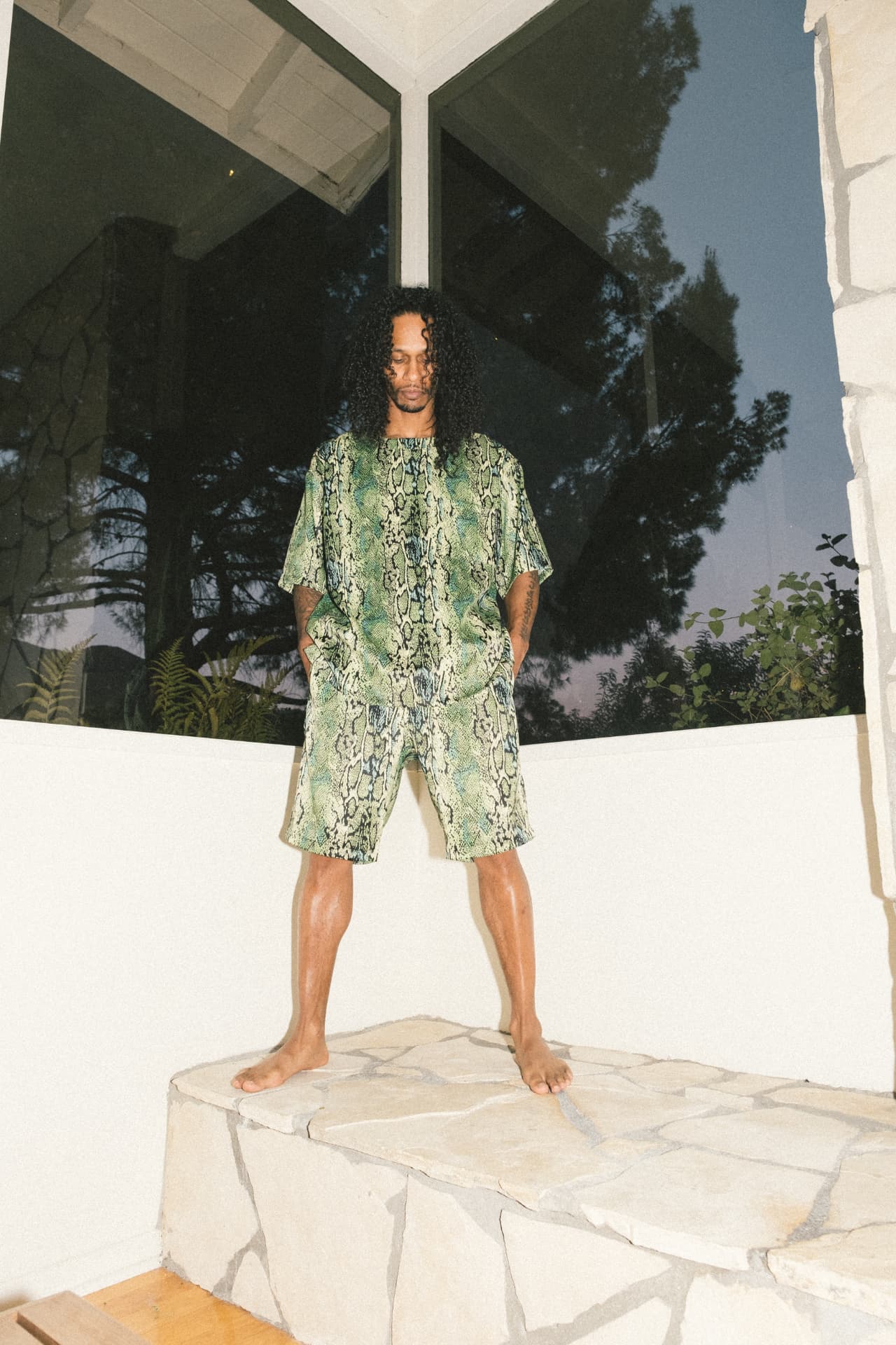 Snakeskin-print short set photographed at dusk