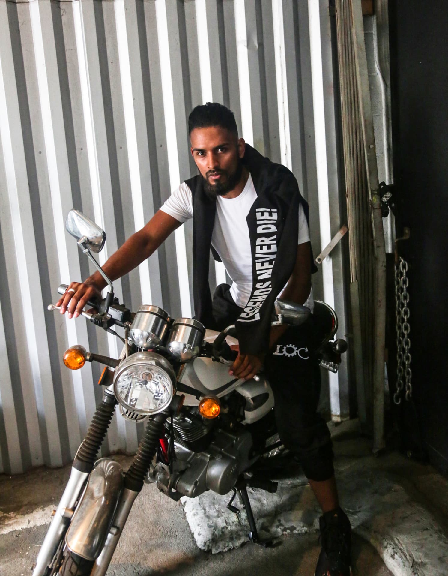 Legends Never Die scarf and black set photographed with a vintage motorcycle