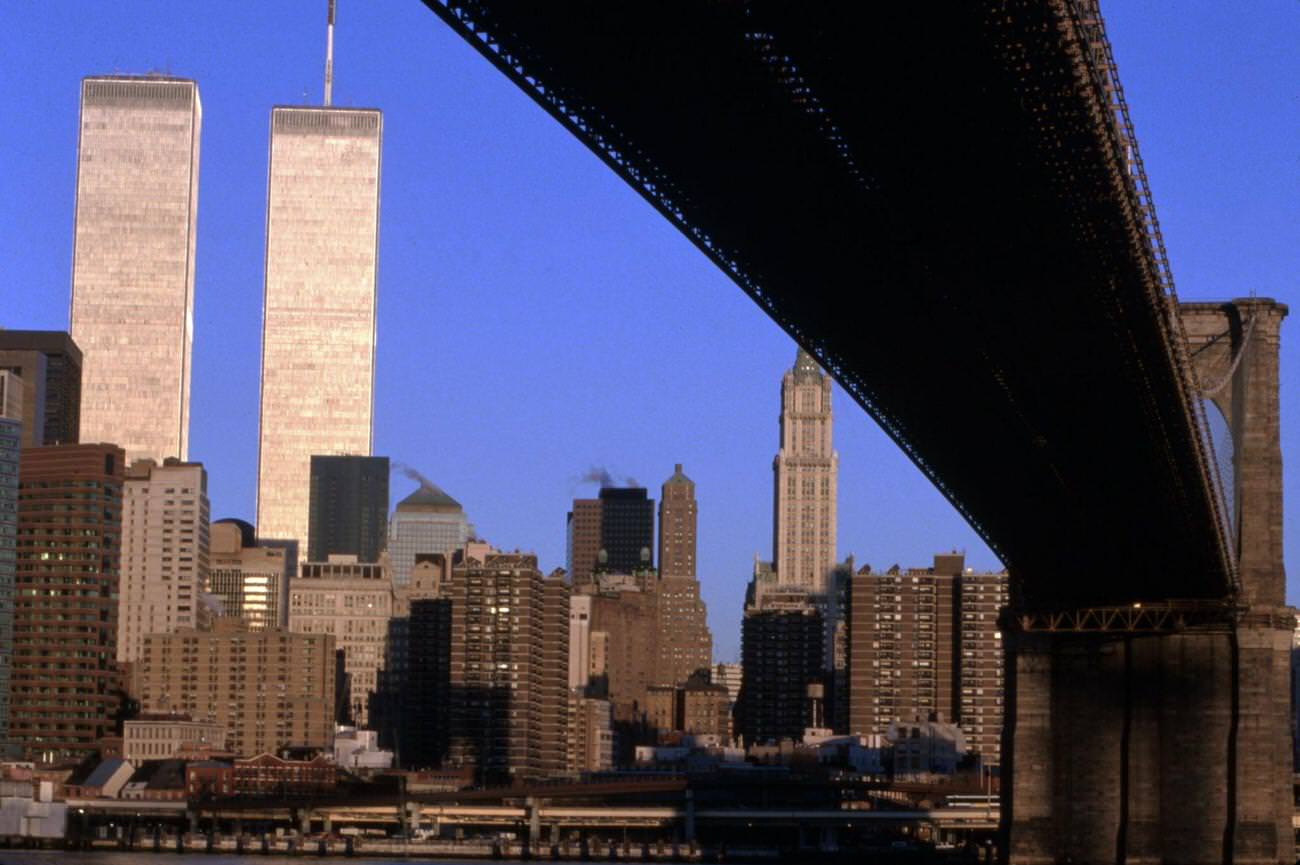 The Lower Manhattan skyline seen from beneath a New York bridge span.
