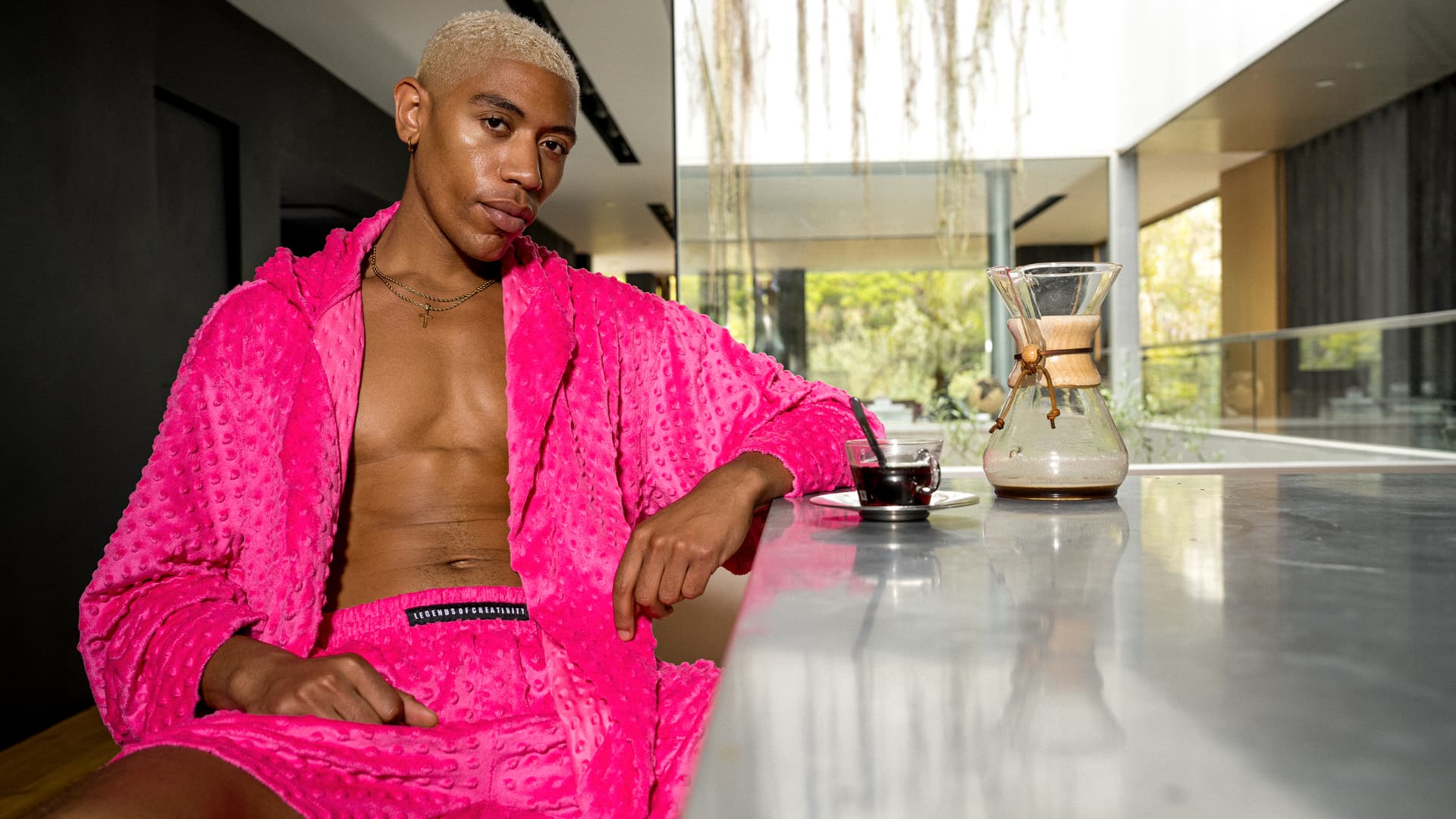 Hot pink textured robe and shorts photographed in a modern interior