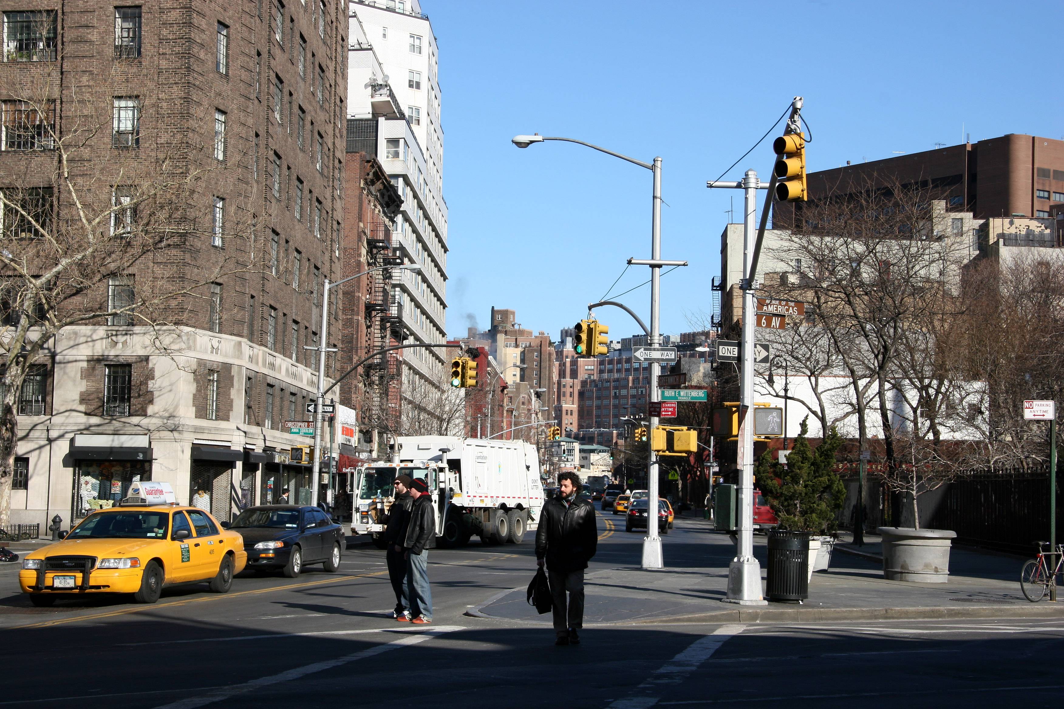 Sixth Avenue at Greenwich Avenue in the Village, looking down the corner on a clear winter afternoon.