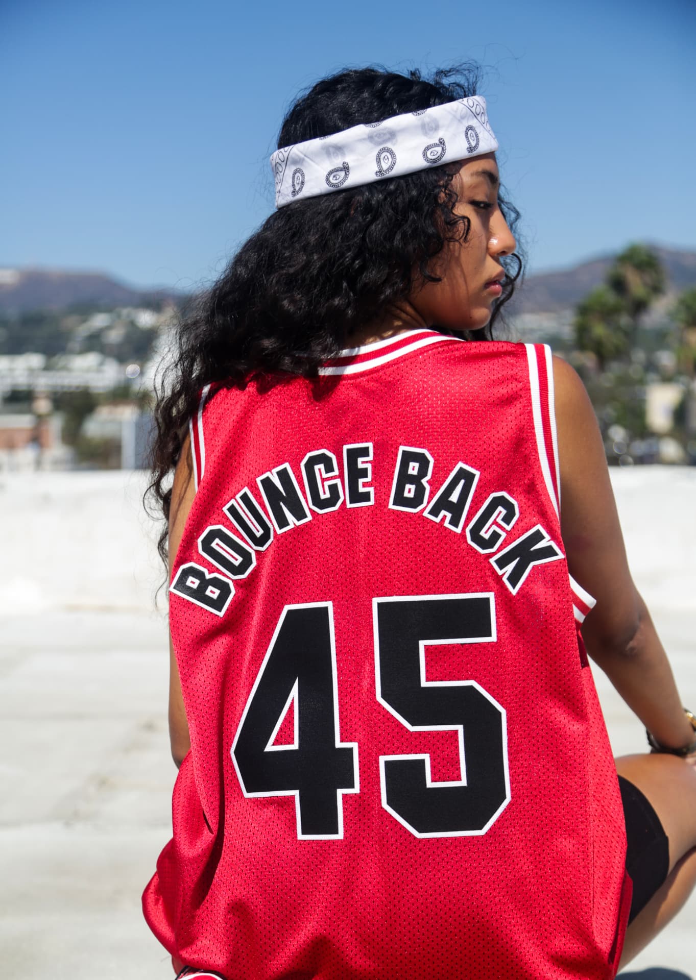 Back of the red mesh jersey, number and arched lettering
