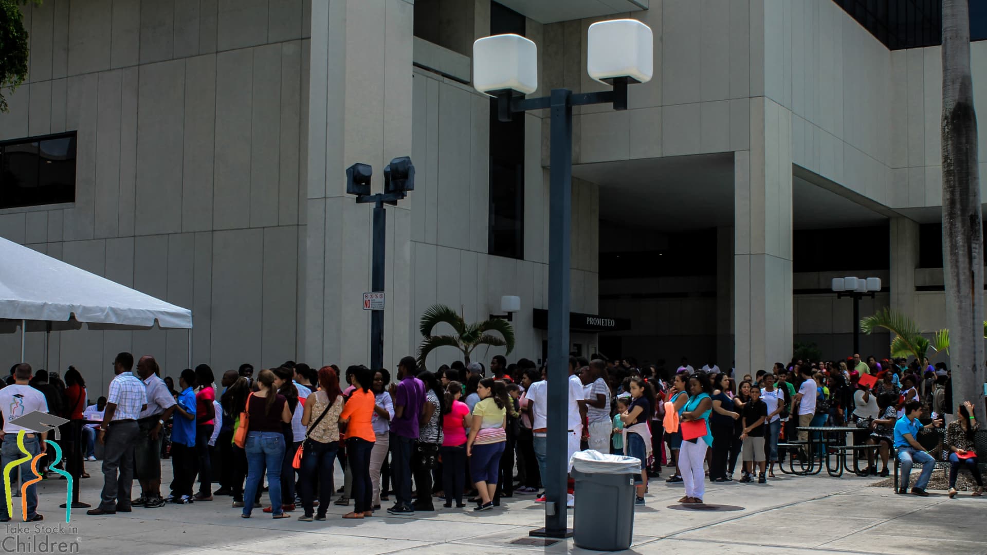 Take Stock in Children students, families, mentors, and community partners gathering outside Miami Dade College during an ILMG-supported outreach event.